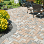 Picture of multi colored tan tiled patio with landscaping and patio furniture